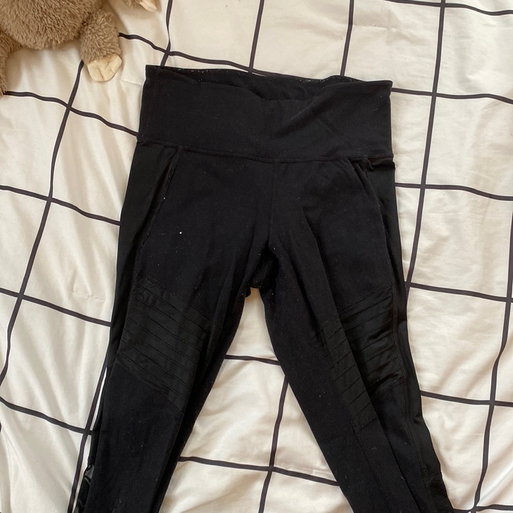 Black Athleta leggings with mesh on calf’s